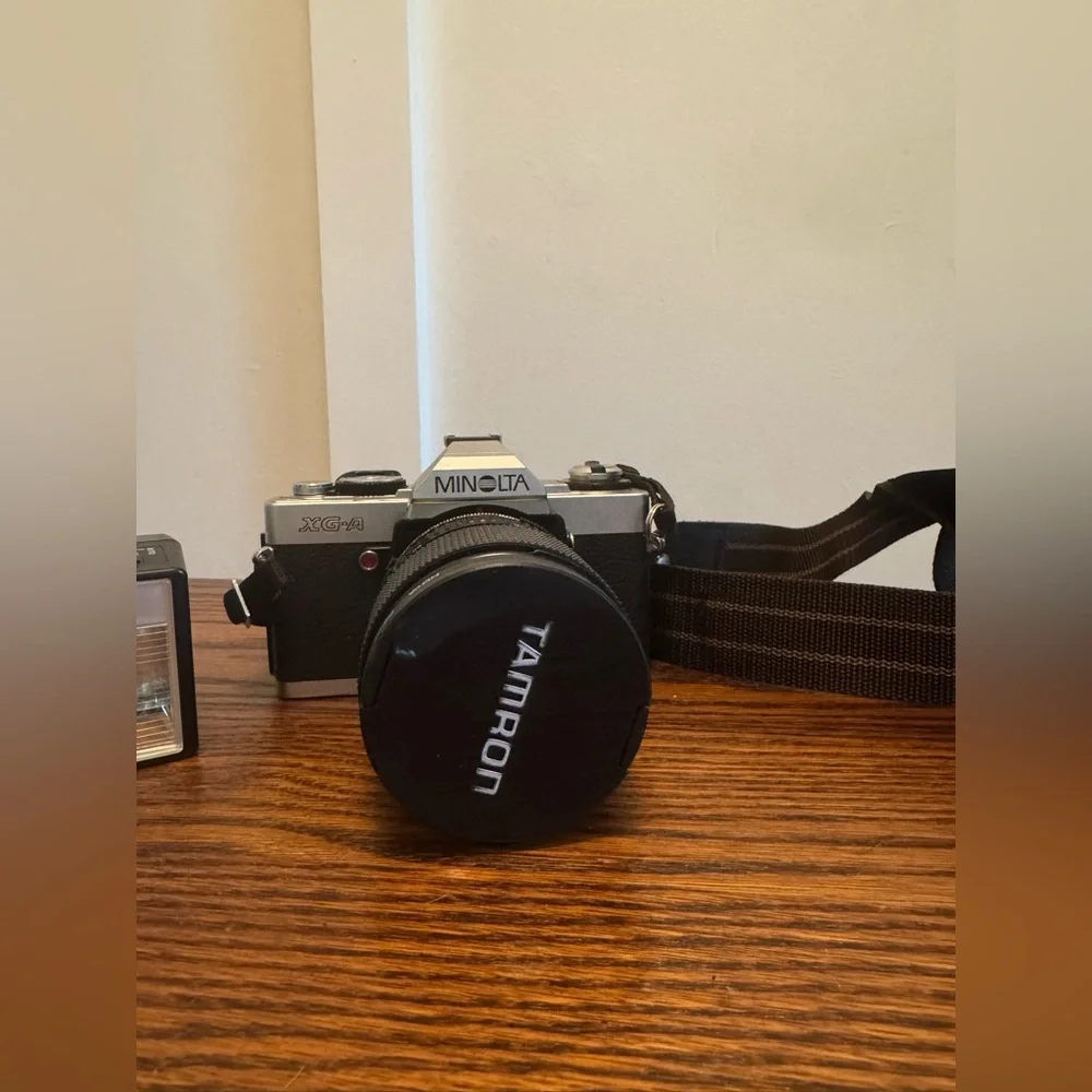 Minolta XG-A 35mm Film Camera with Black Tamron Lens Cap and photo flash Unit